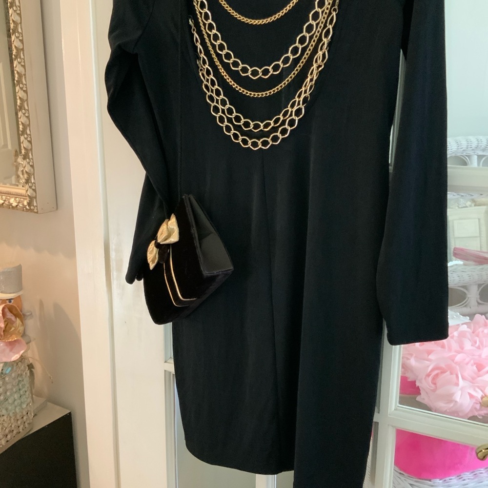 Elegant Black Dress Featured with a pretty black and gold bow bag included